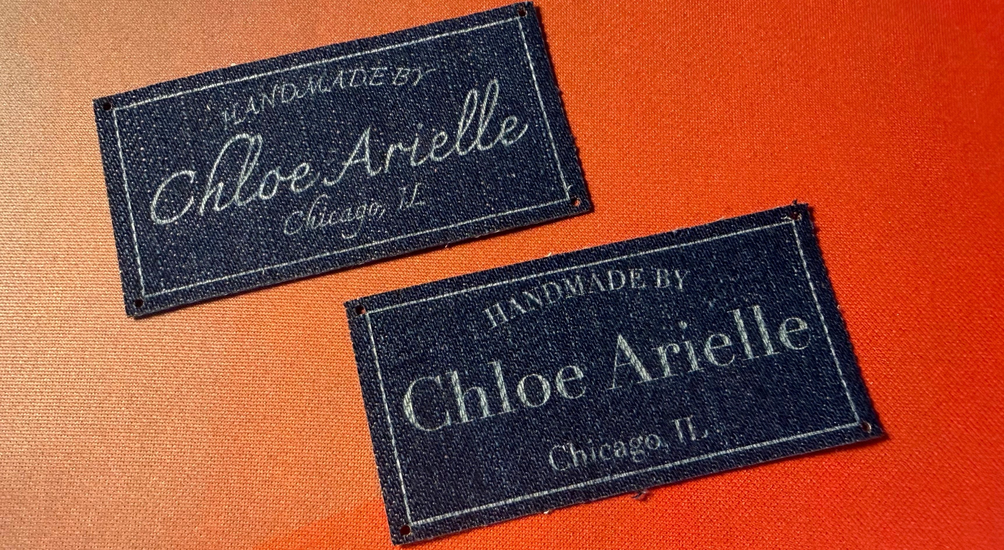 Two denim labels with 'Handmade by Chloe Arielle, Chicago, IL' text on a gradient background.